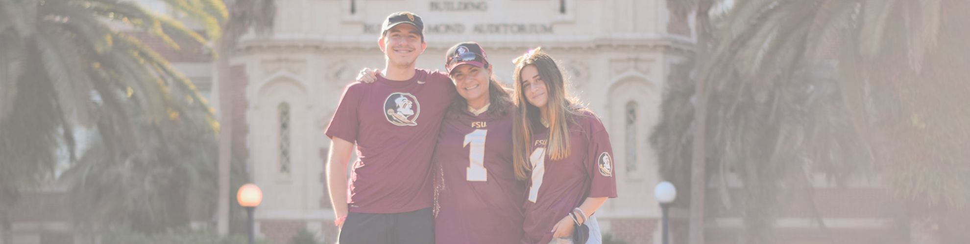 family smiling and posing in front of westcott
